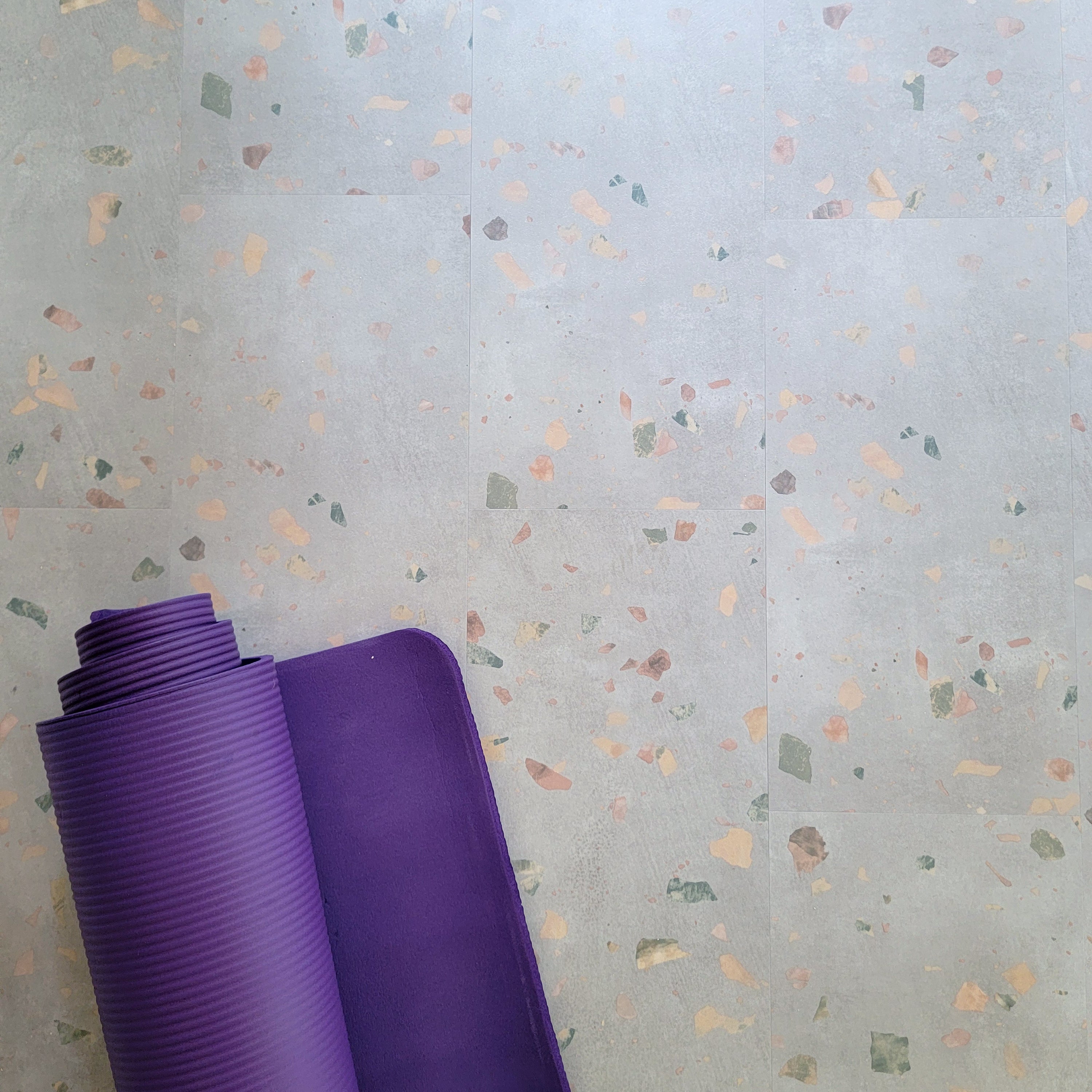 Allure Ultima Comfit Terrazzo vinyl flooring with a purple yoga mat