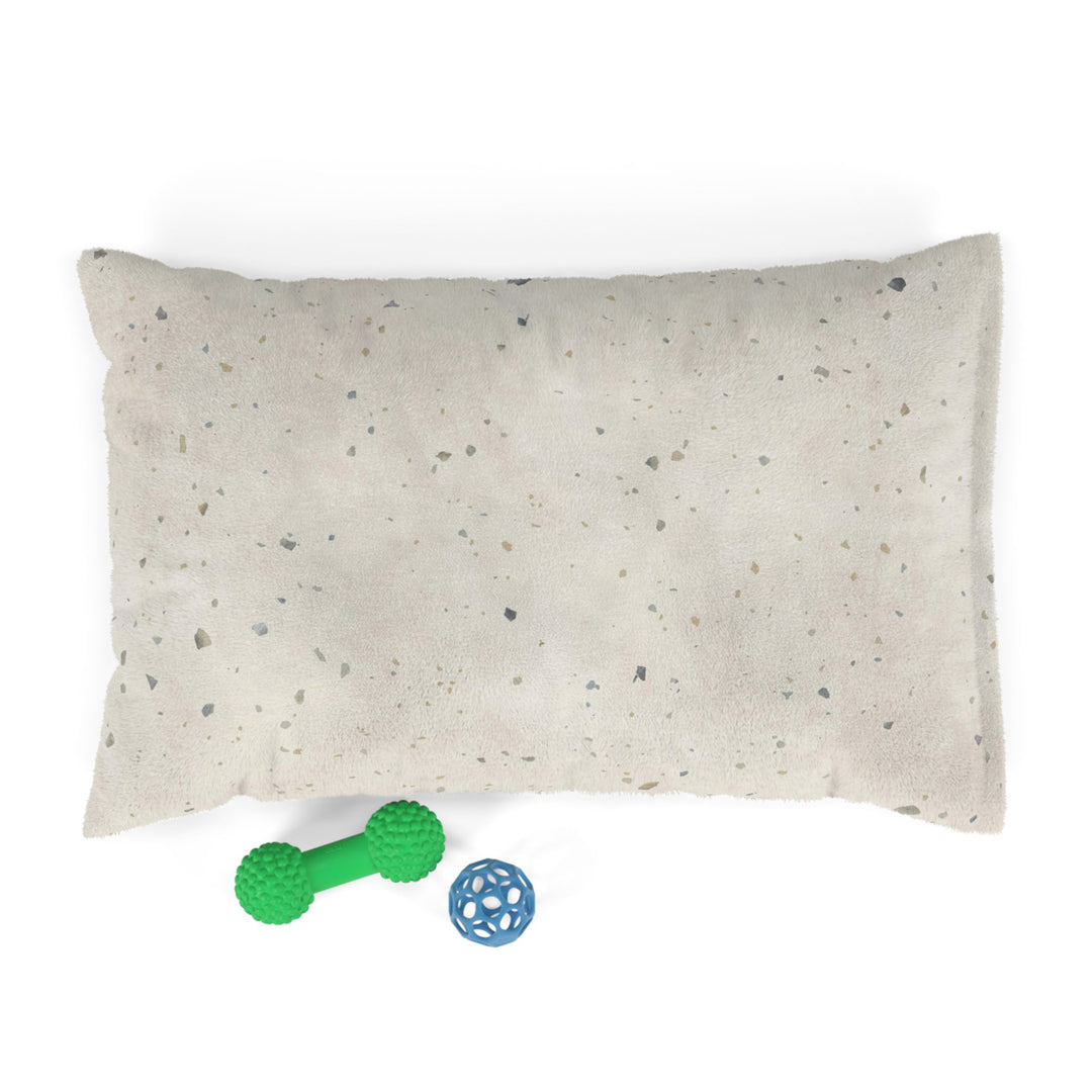 small dog bed in perfect parfait terrazzo design with dog toys