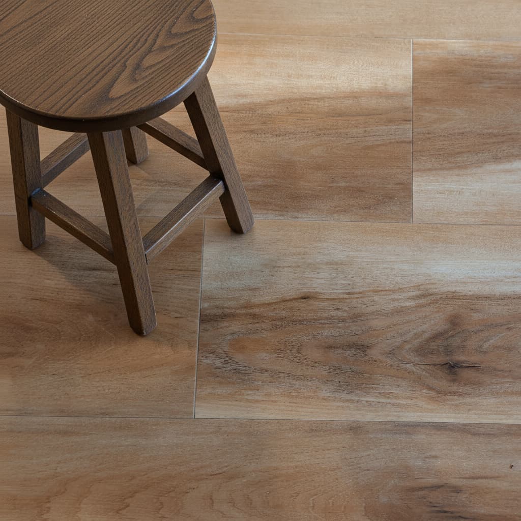 Close up of hickory wood look LVP flooring with small stool