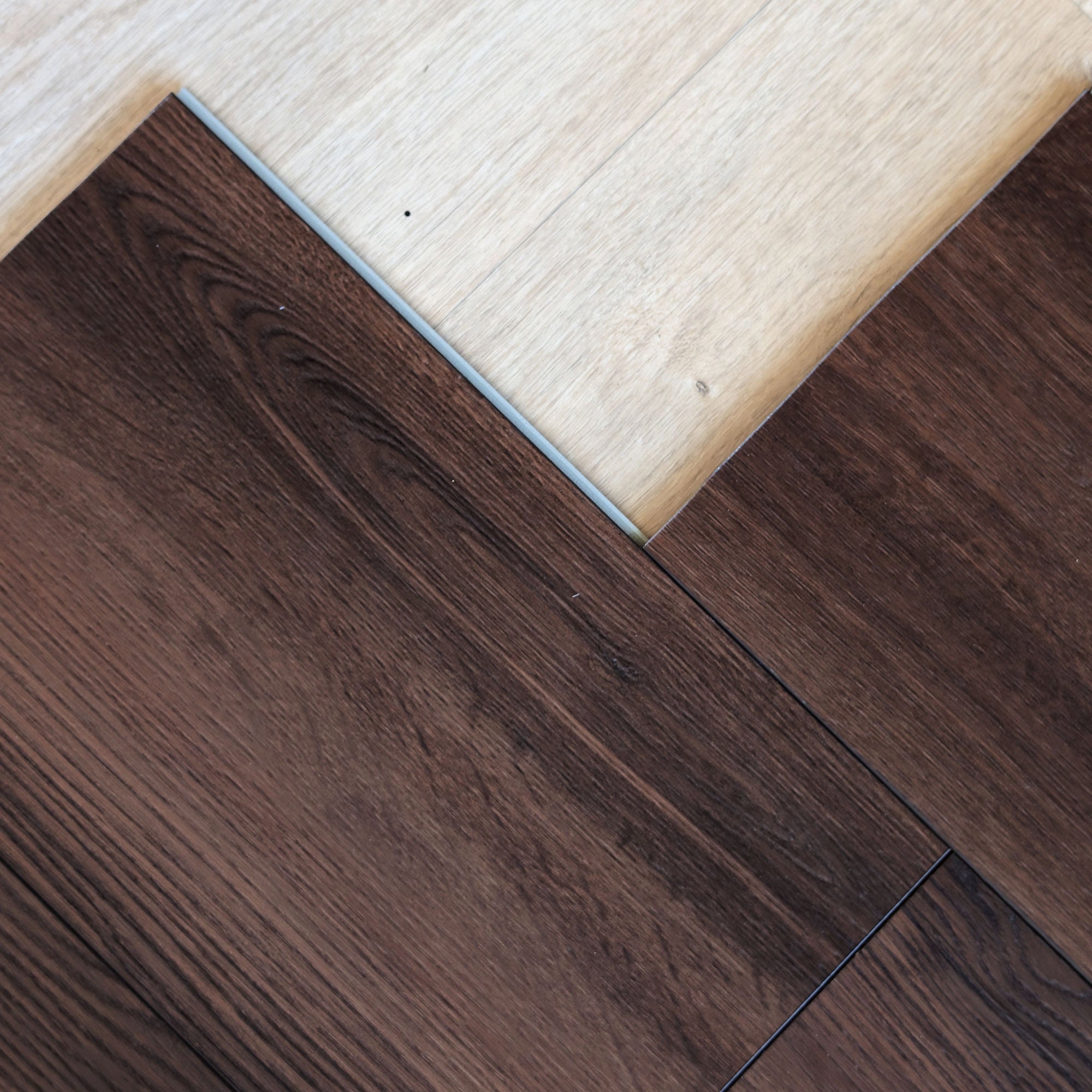 dark wood flooring partially installed showing the click lock profile edge