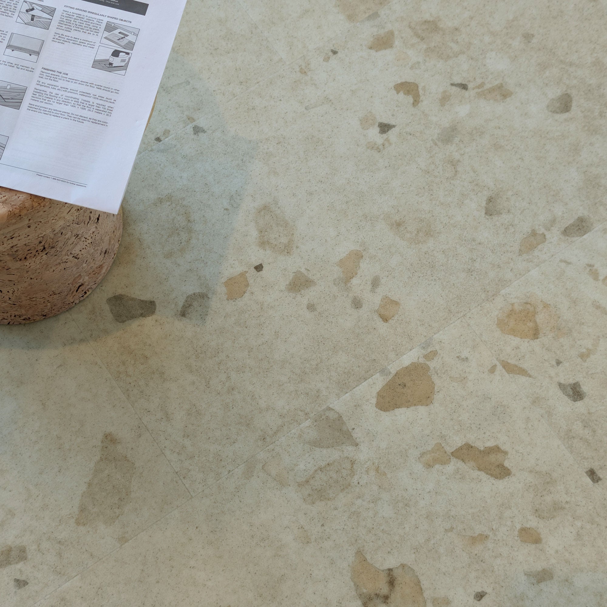 Allure Colada Concrete terrazzo LVT flooring with side table and instruction manual
