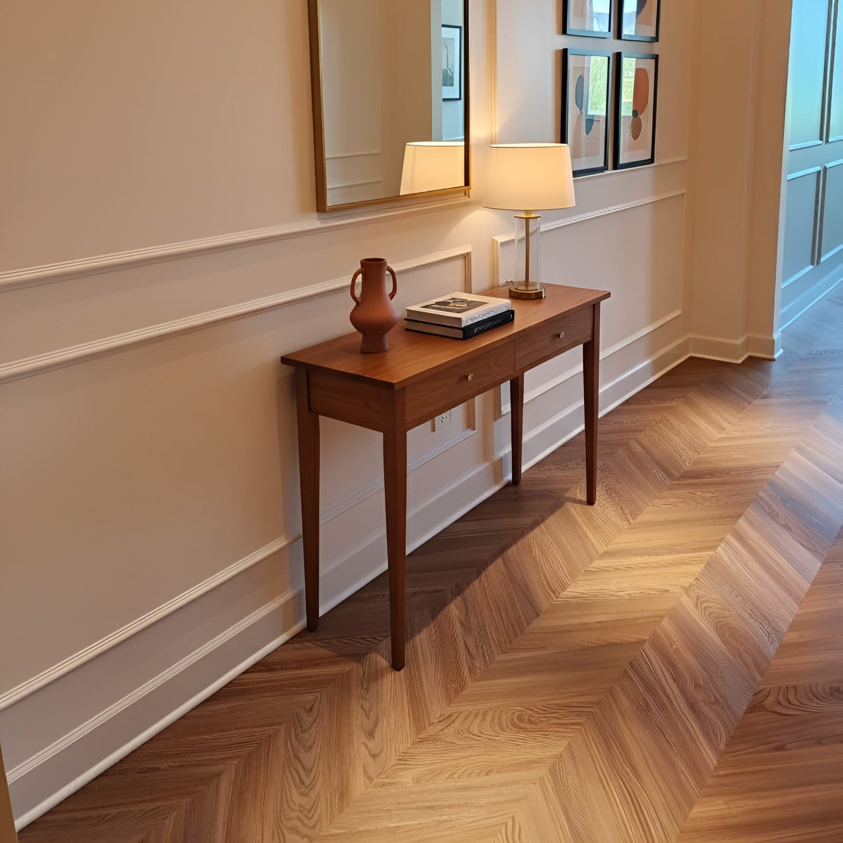 Peach Crisp Pine installed in a hallway with a wooden console table with a lamp and decorative items against a wall with a mirror and framed pictures.