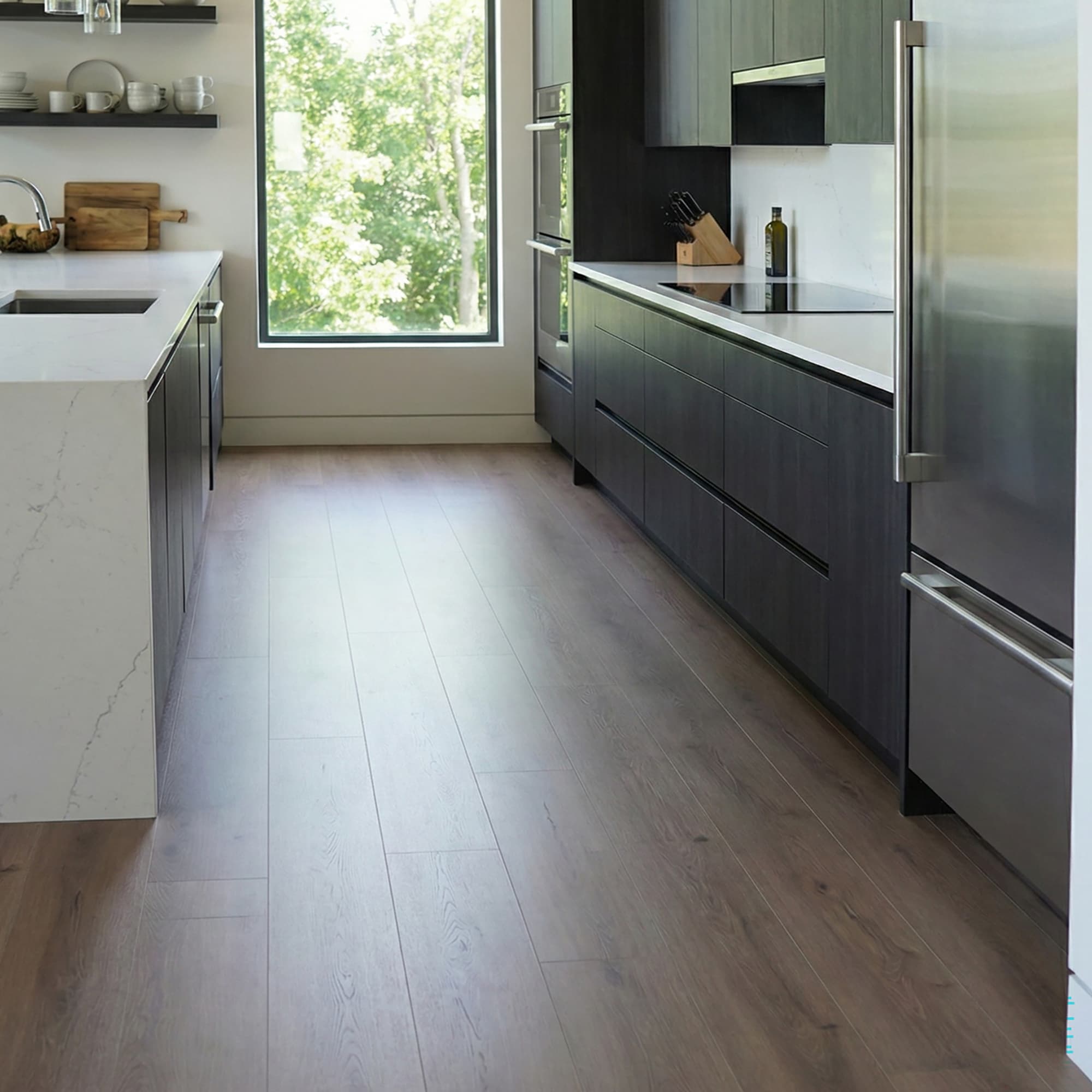 Modern kitchen with stainless steel appliances and Allure LVP flooring