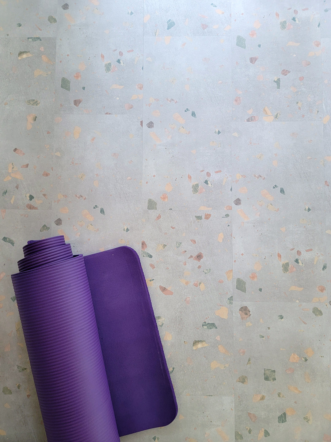 Allure Ultima Comfit Terrazzo vinyl flooring with a purple yoga mat