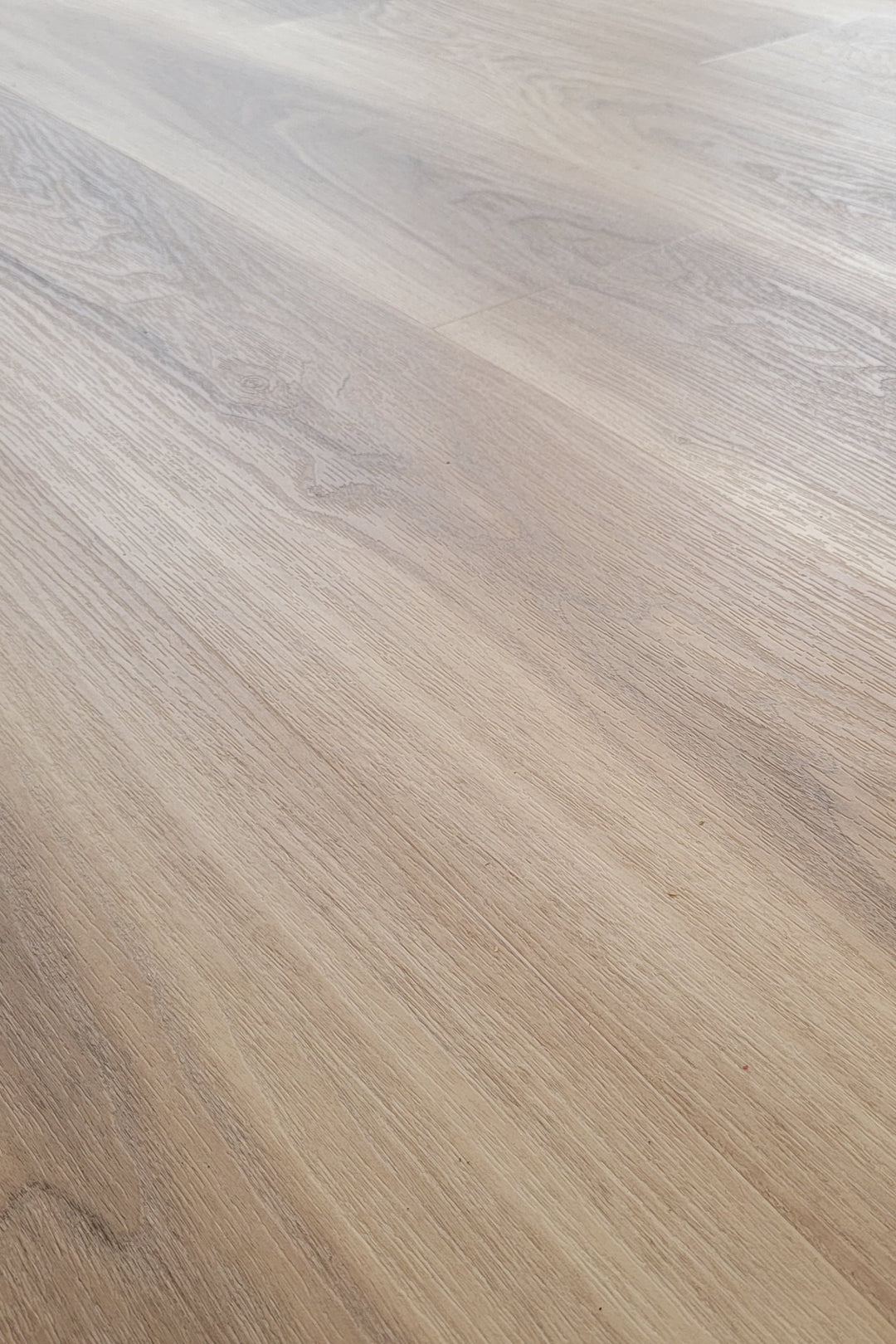 Close up of Allure almond honey aspen LVP installed