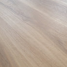 Close up of Allure almond honey aspen LVP installed