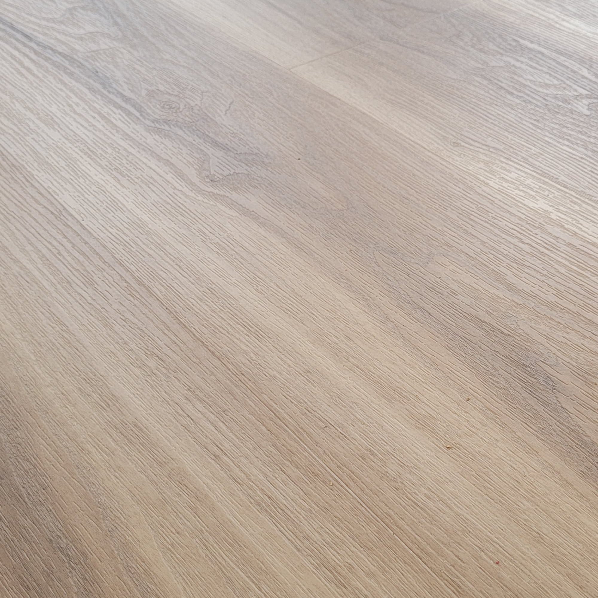 Close up of Allure almond honey aspen LVP installed