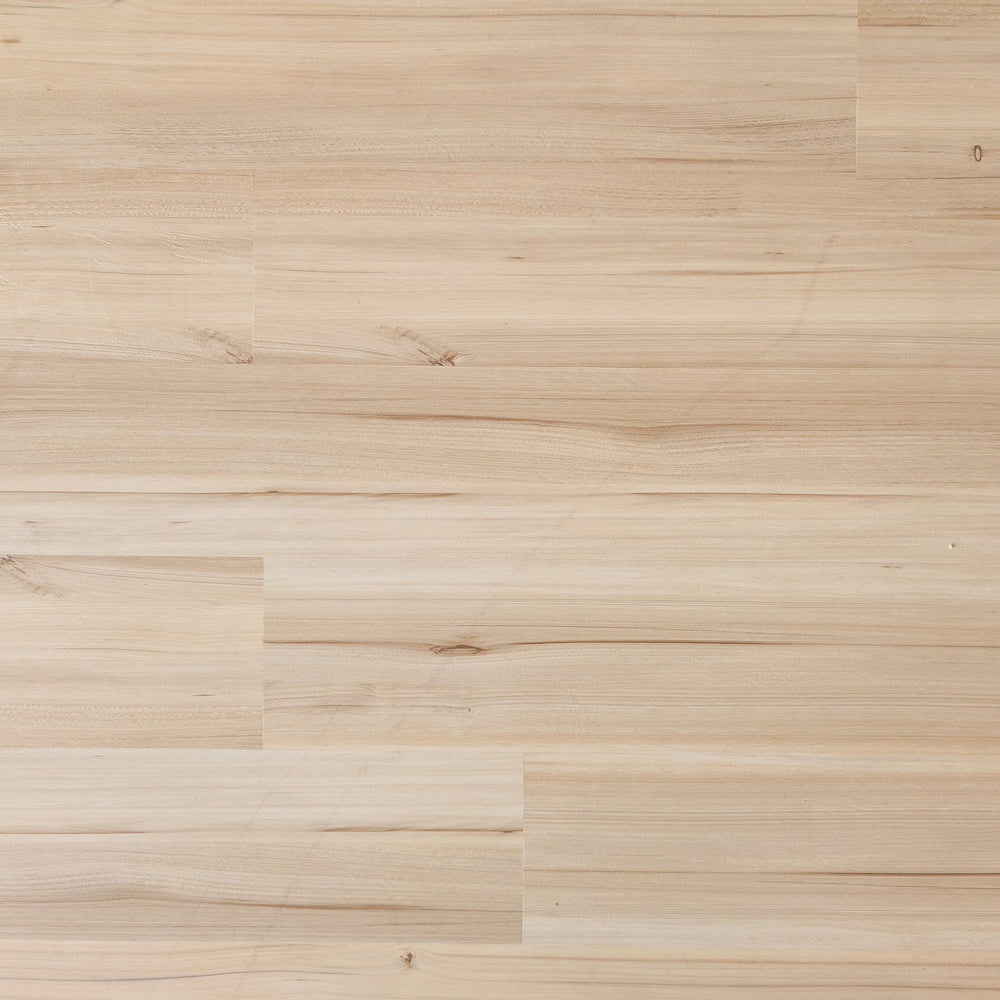 Close-up of a Allure green tea tulip vinyl plank floor with a natural finish