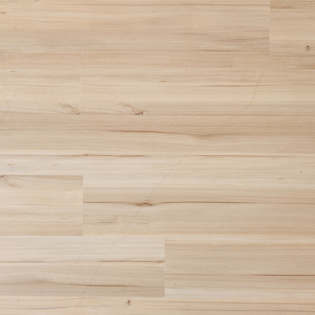 Close-up of a Allure green tea tulip vinyl plank floor with a natural finish