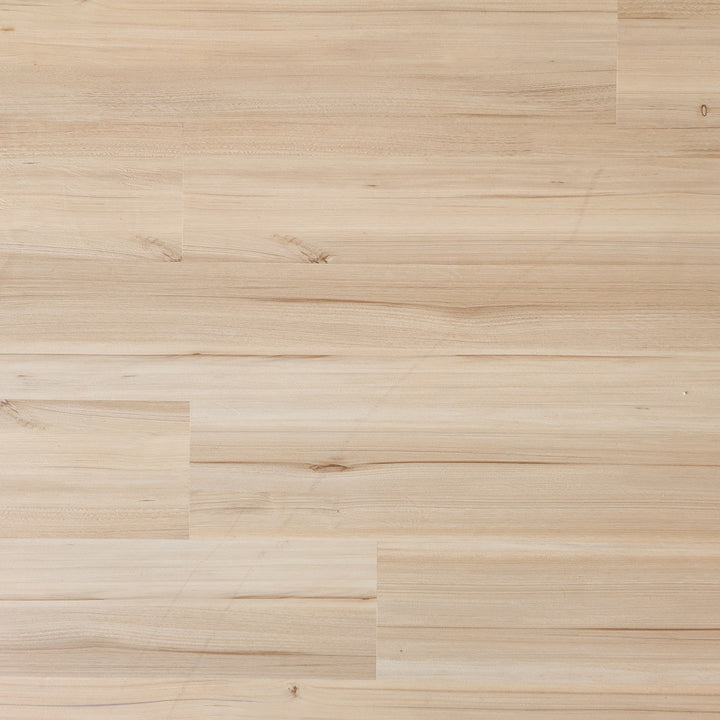 Close-up of a Allure green tea tulip vinyl plank floor with a natural finish