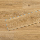 Allure Vinyl Flooring in Contemporary Oak Cappuccino installed floor view from above with close up of single plank laying on top showing grooves and edges