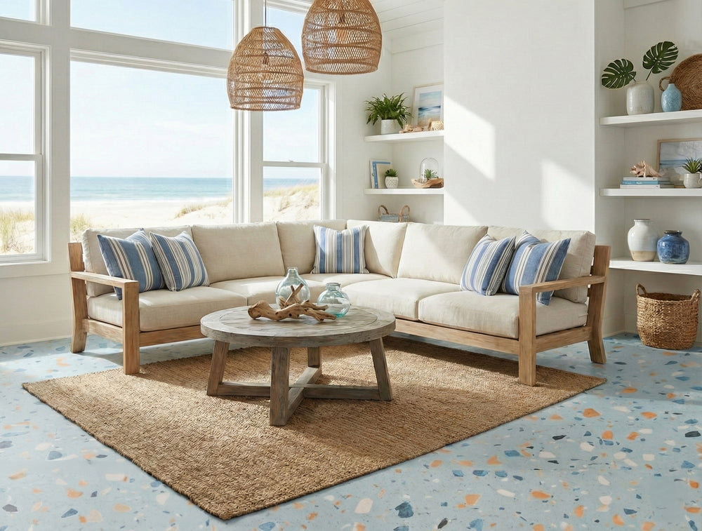 Beach house living room with a sectional sofa, coffee table, and decorative items on Allure blue agave terrazzo LVT flooring