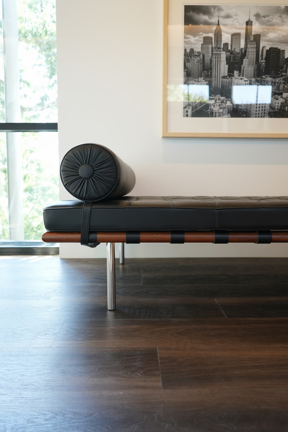 Allure buckeye black walnut lvp with modern chair and black and white photo on a white wall