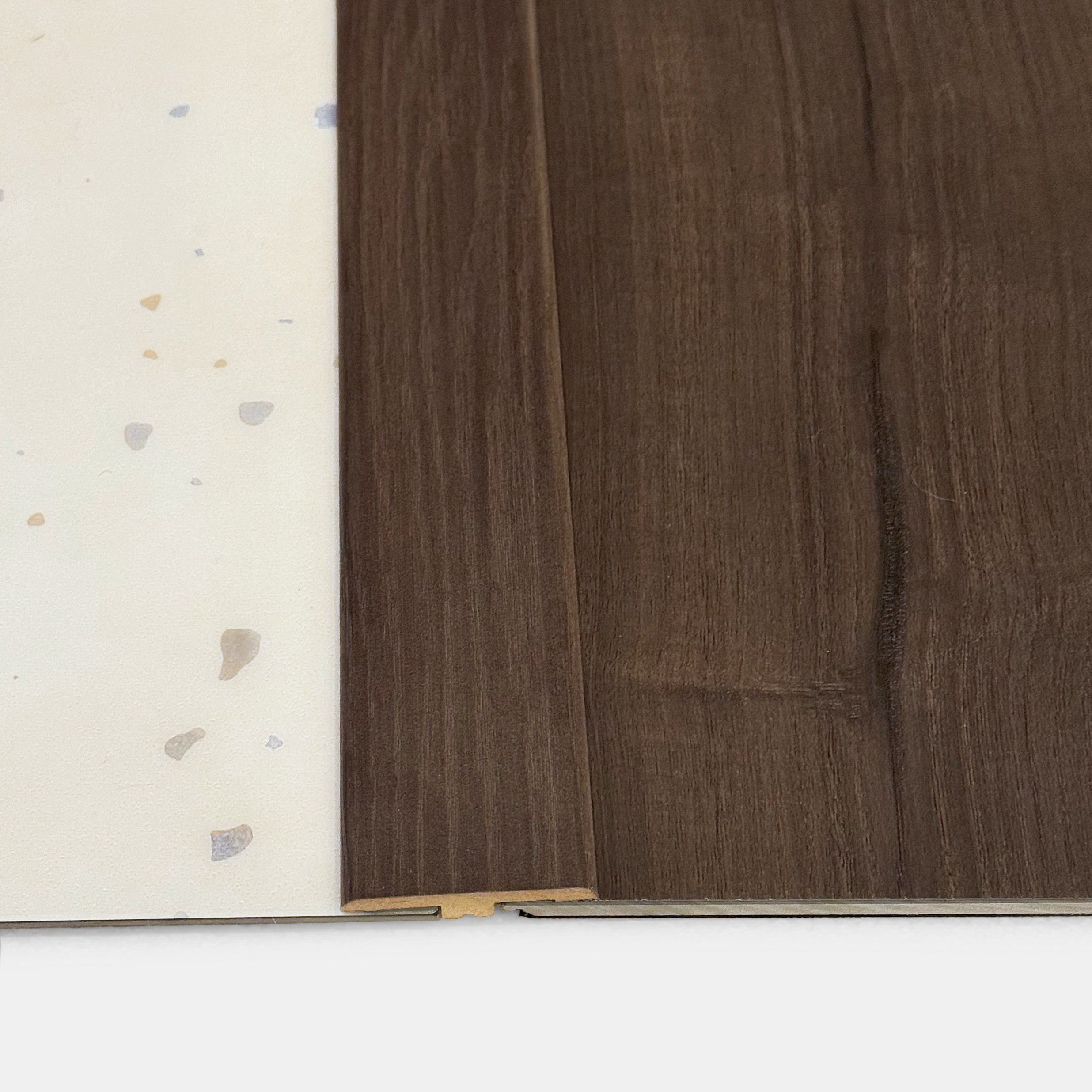 Transition strip between Burnt Butter Walnut LVP and Terrazzo LVP