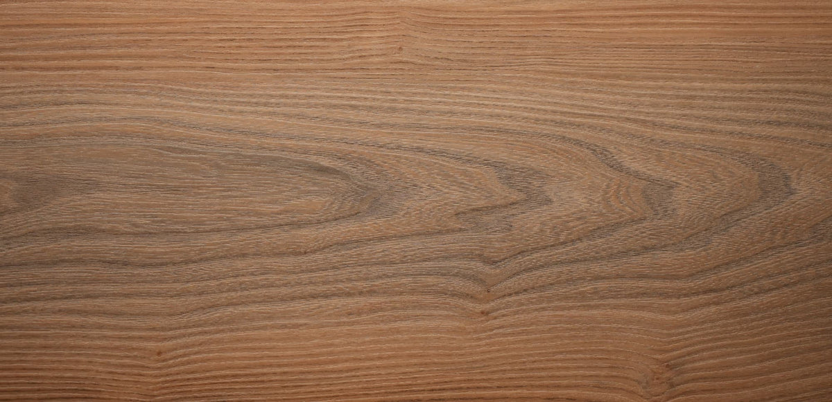 Close-up of a vinyl flooring with wood texture with visible grain and texture