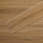 AllureLVP Flooring in Contemporary Oak Mocha installed floor view from above with close up of single plank laying on top showing grooves and edges