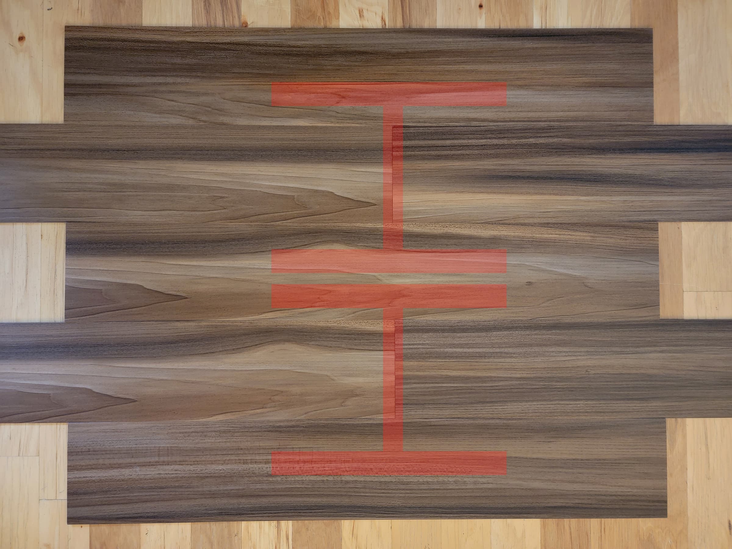 Vinyl flooring showing installation with an H pattern.