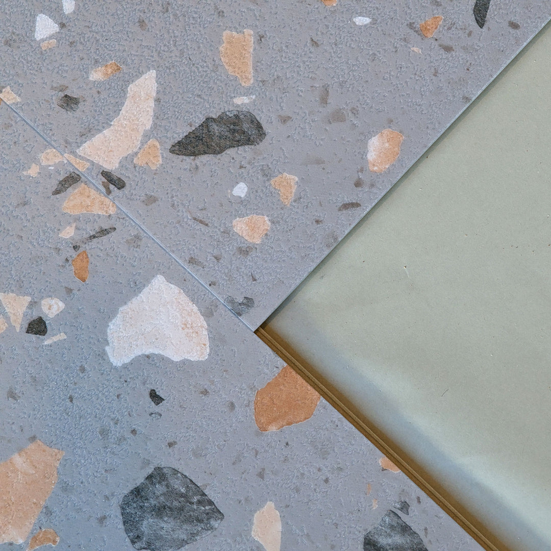 Allure Ultima Peach Pebble Terrazzo vinyl tile flooring close up view of click lock edge and microbevel