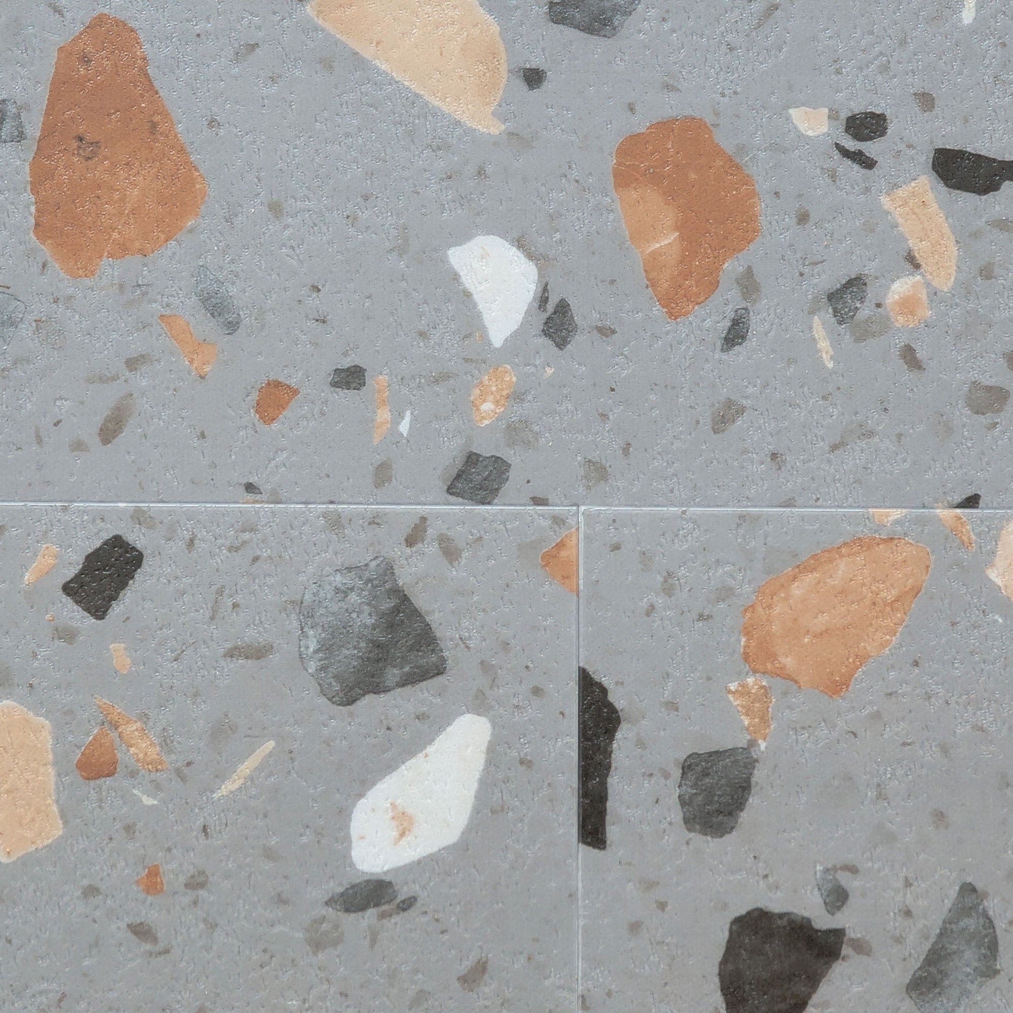 Close up of  Ultima Peach Pebble terrazzo LVT microbevel tile connections