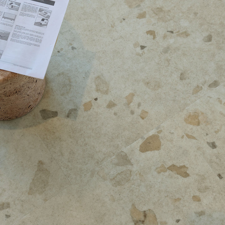 Allure Colada Concrete terrazzo LVT flooring with side table and instruction manual