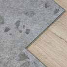 Close up of Galaway Grey terrazzo LVT floor click lock and microbevel edge