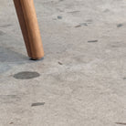 Close up of Galaway Grey terrazzo LVT with chair leg