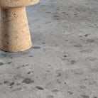 Allure Galaway Grey terrazzo vinyl tile flooring with MCM cork side table