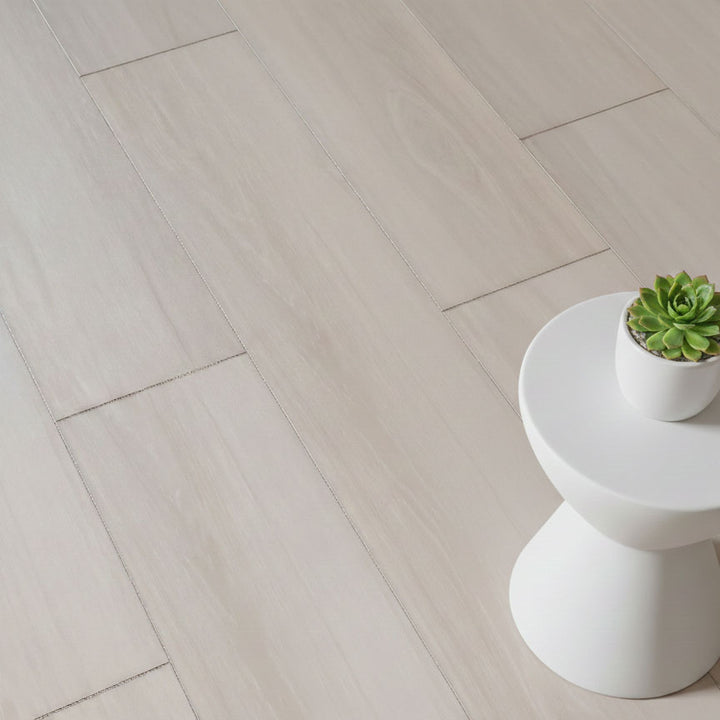 Allure pound cake pecan LVP installed with small table and plant