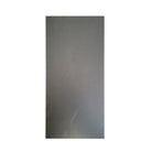 Close-up view of the back of a luxury vinyl tile, showcasing its textured surface and intricate design patterns, emphasizing durability and stability. The material appears robust and ready for installation, highlighting its quality as a flooring option