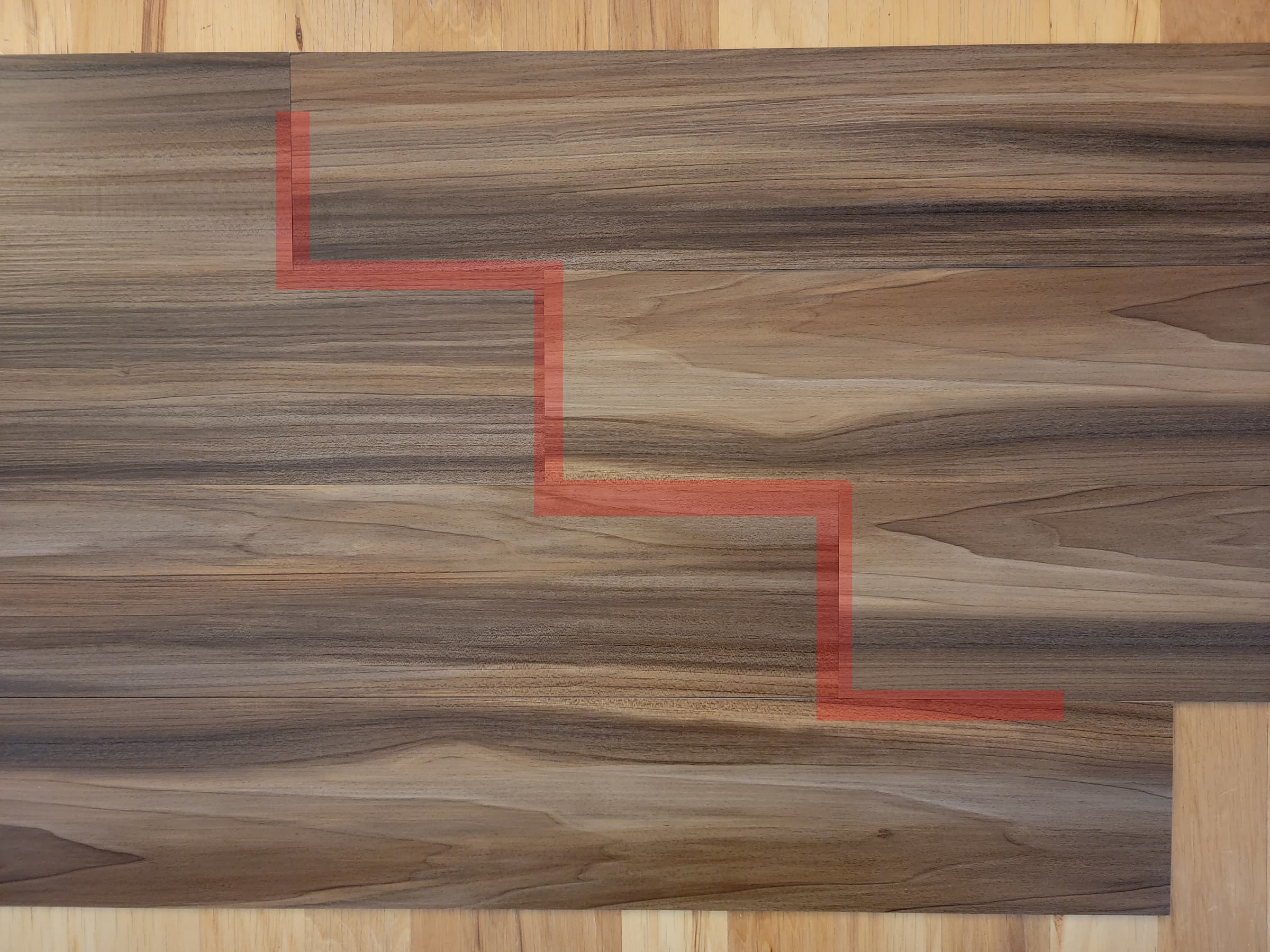 Vinyl flooring showing installation with stair stepping pattern