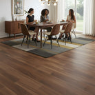 Dining room with Allure Marble cake Mahogany LVP flooring, table, and chairs.