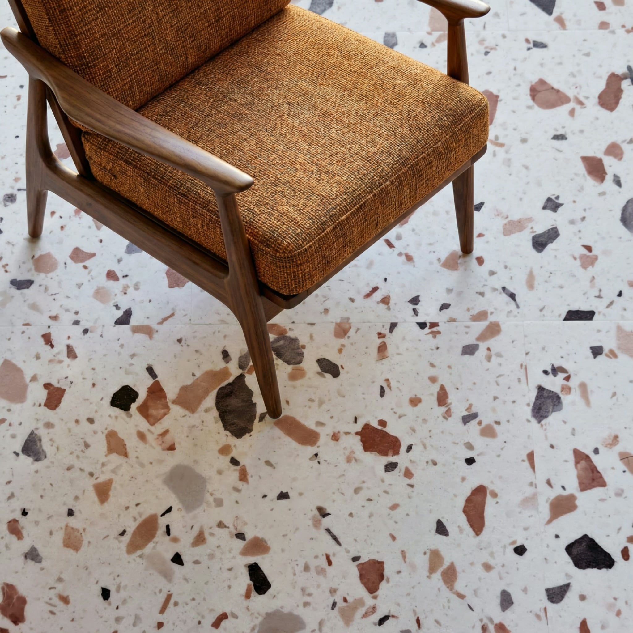 Allure Terrazzo vinyl tile flooring with mid-century modern brown chair