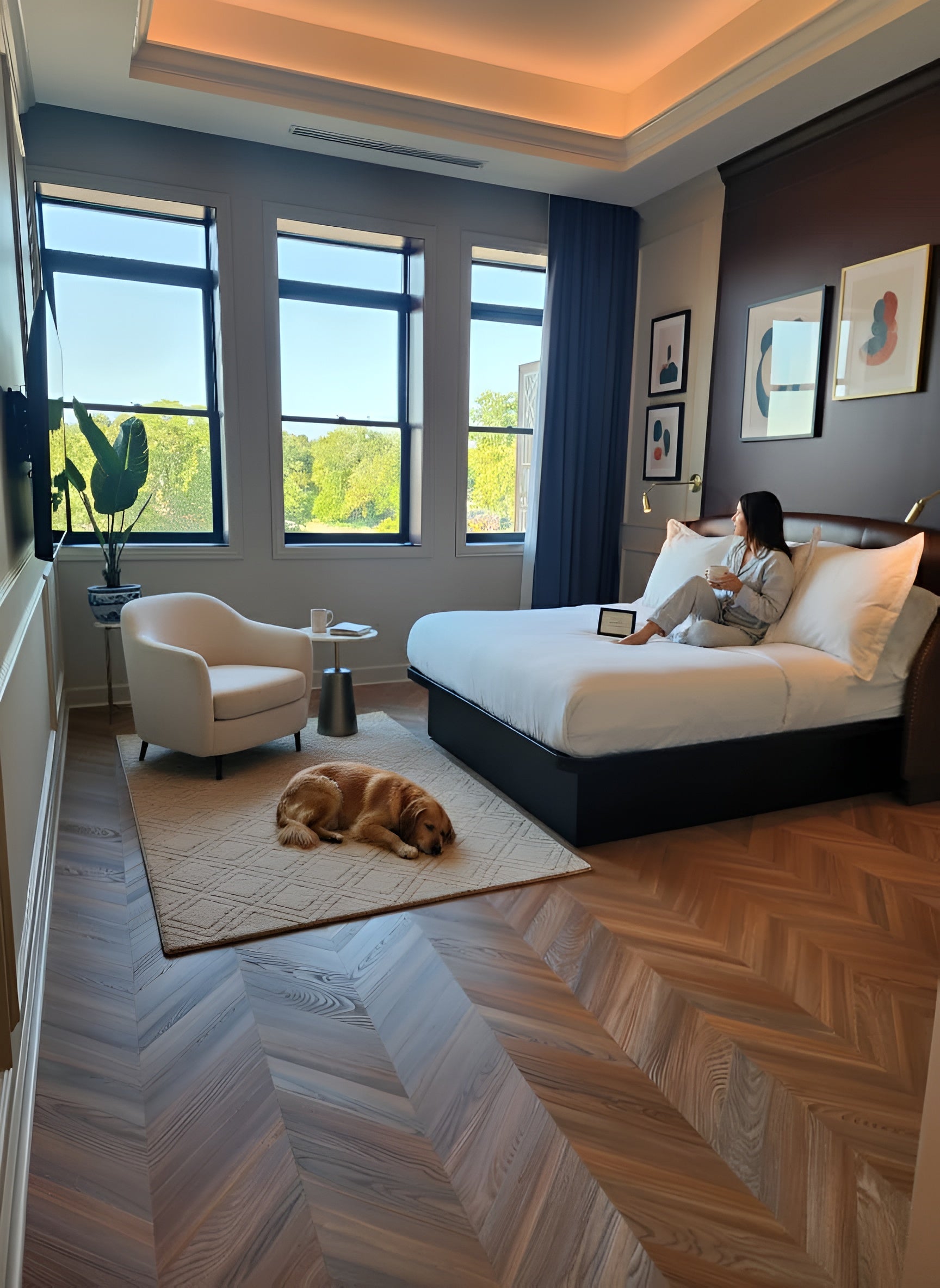 Peach Crisp Pine Chevron installed in a modern bedroom with a large bed, armchair, and window view