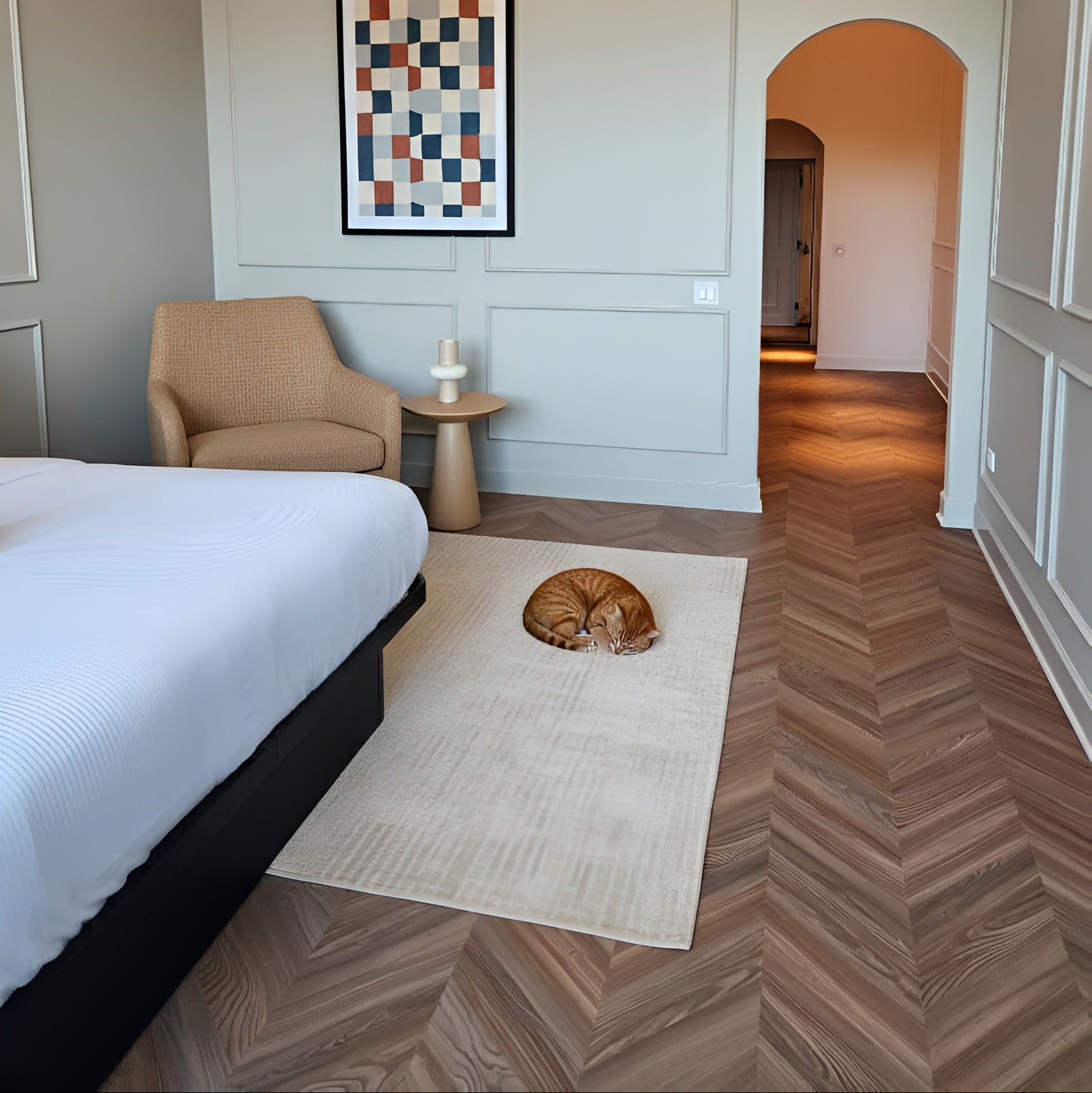 Peach Crisp Pine installed in a modern bedroom with a bed, armchair, and abstract art on the wall.