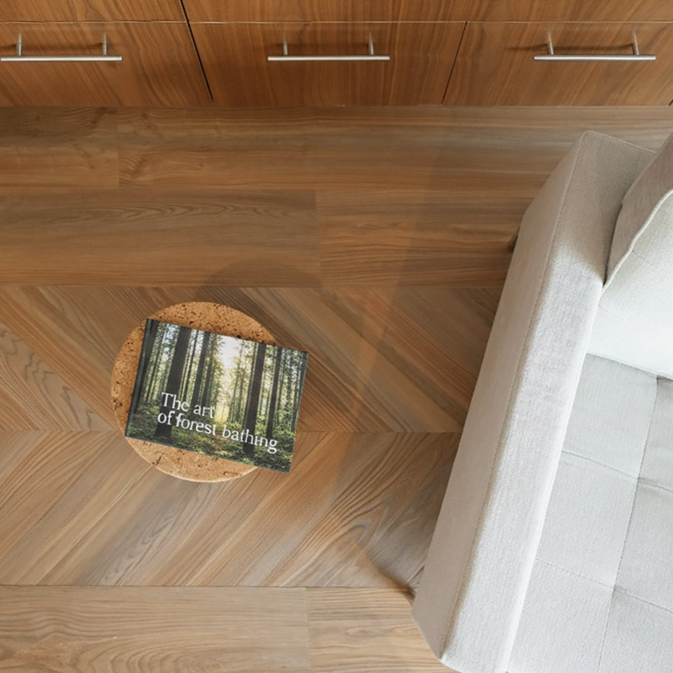 Allure Peach crips pine chevron flooring with cabinets small end table, and modern white chair.