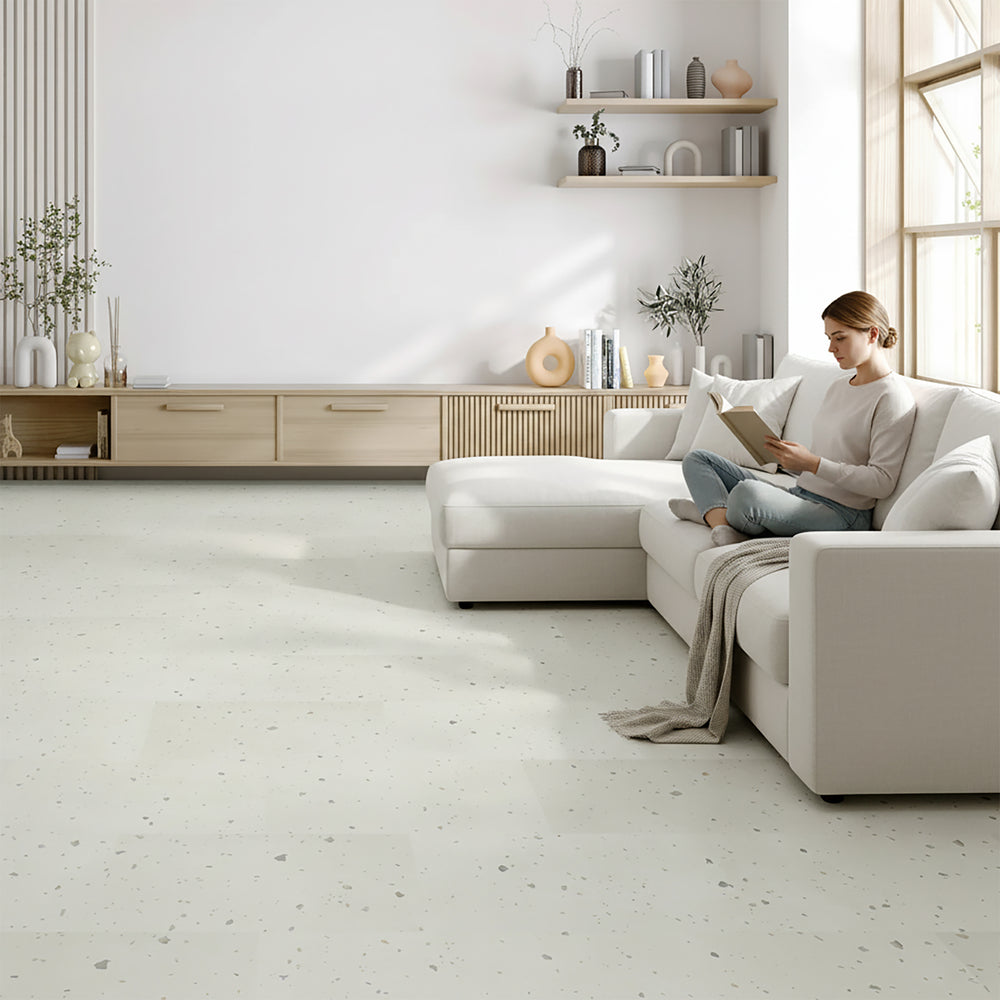 Woman reading in modern living room with allure terrazzo flooring