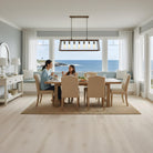 Dining room with a view of the ocean, Allure Soft Oak Sand LVP flooring, and a mother and daughter eating at a table.