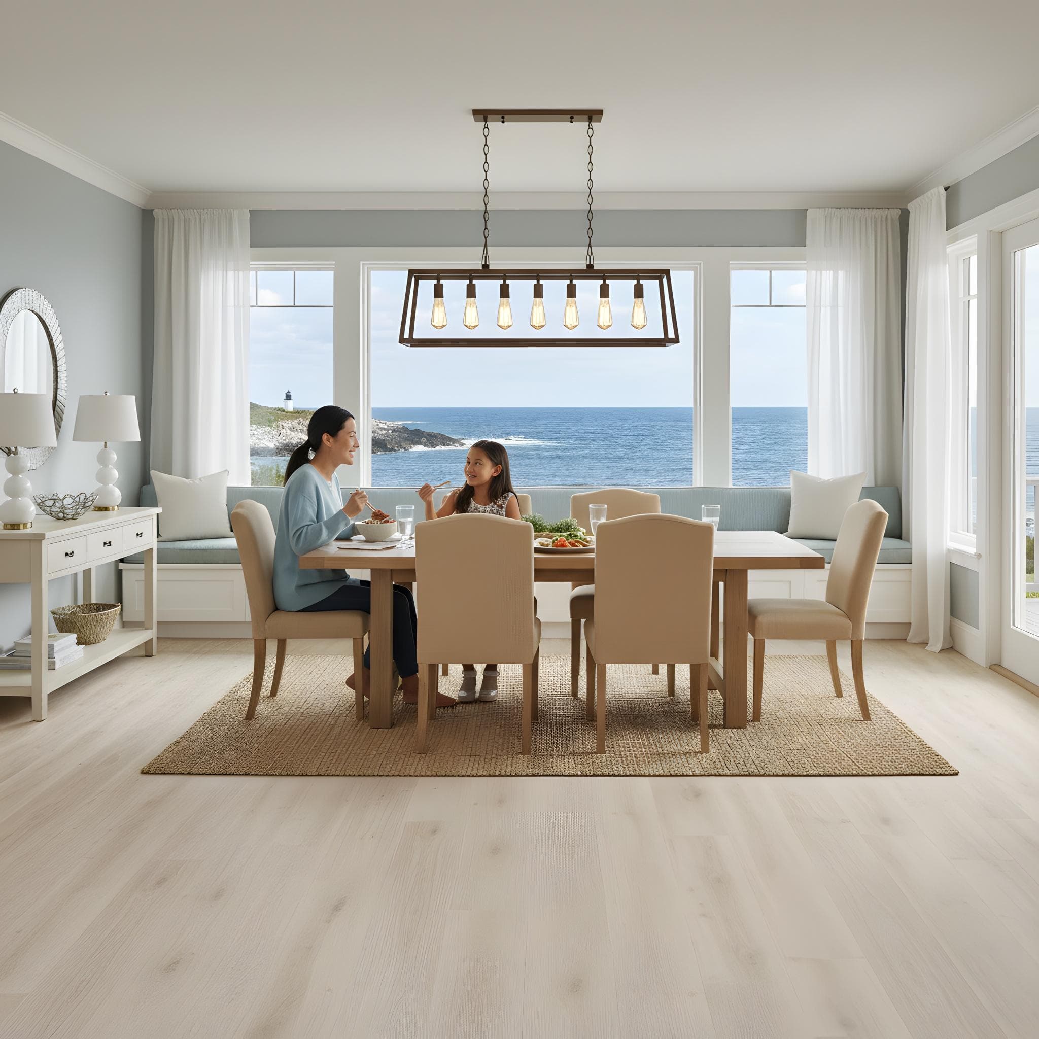 Dining room with a view of the ocean, Allure Soft Oak Sand LVP flooring, and a mother and daughter eating at a table.