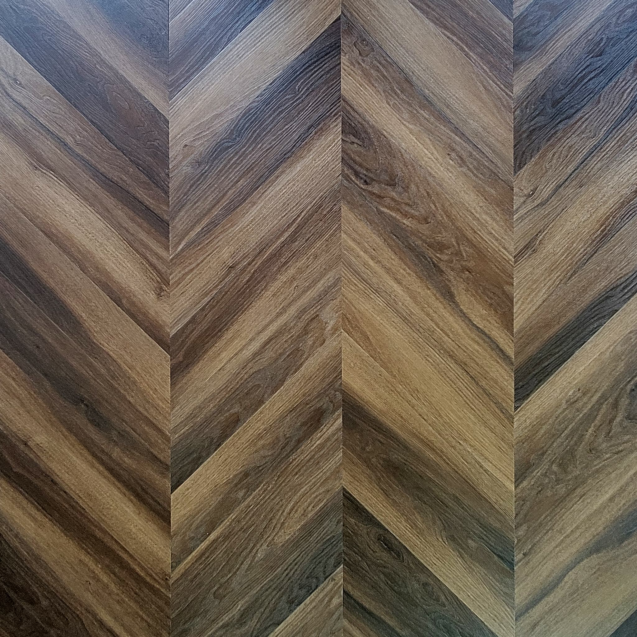 Allure Buckeye black walnut luxury vinyl flooring in chevron pattern in brown and gray tones.