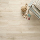 Wooden floor with a rope ball and seashells on a light wooden surface